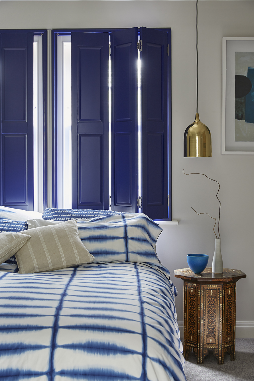 Royal blue solid shutters in bedroom by Shutterly Fabulous