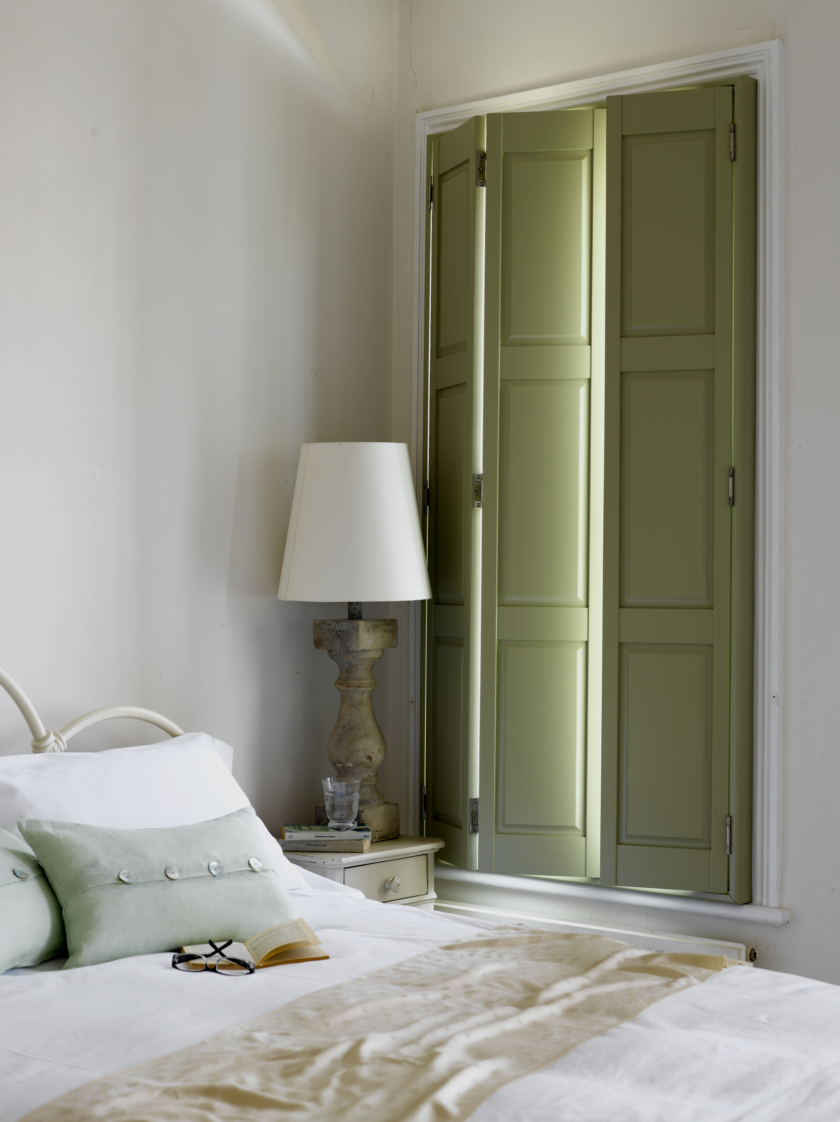 green full height shutters in bedroom