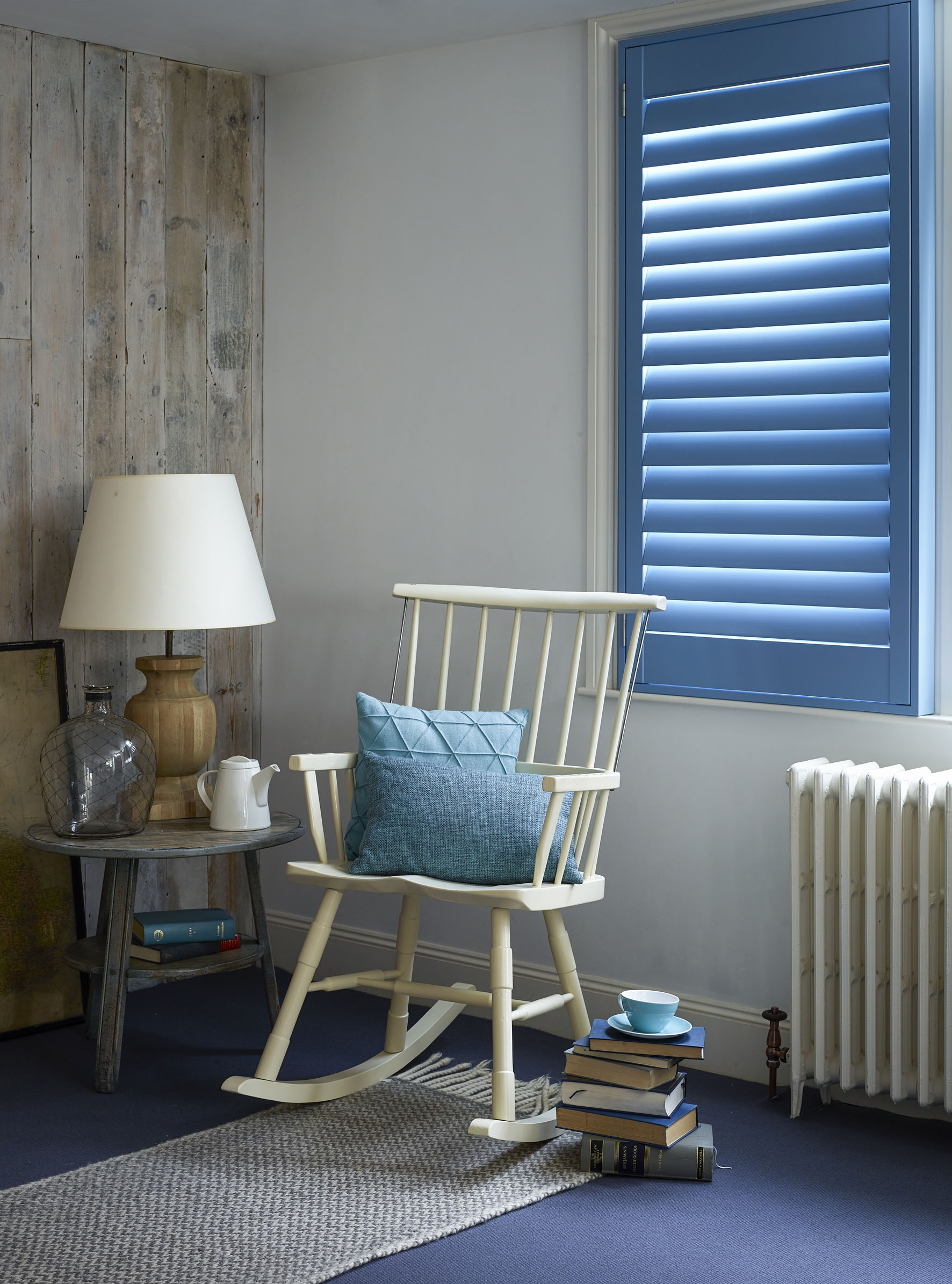 Custom blue full height shutters for the living room