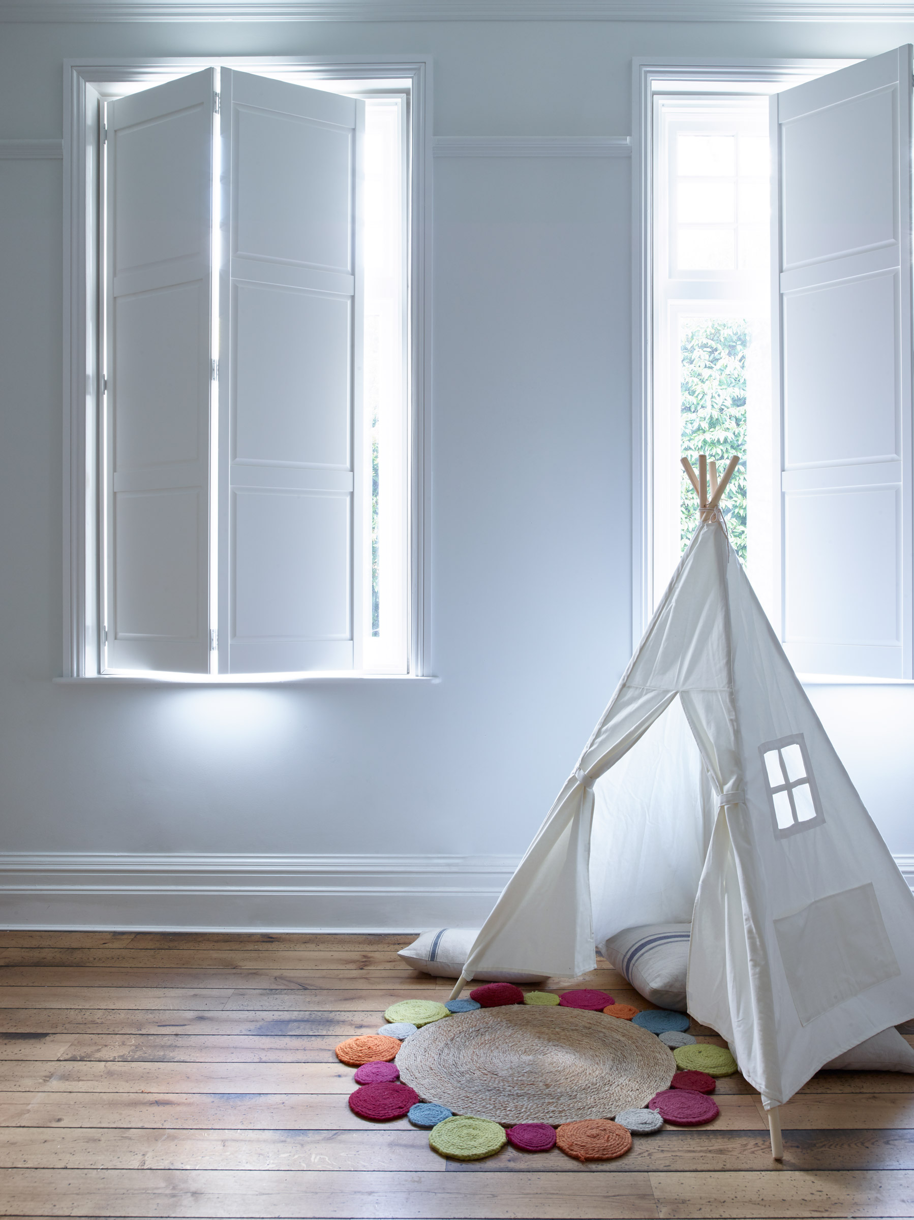 white solid panel shutters against white walls