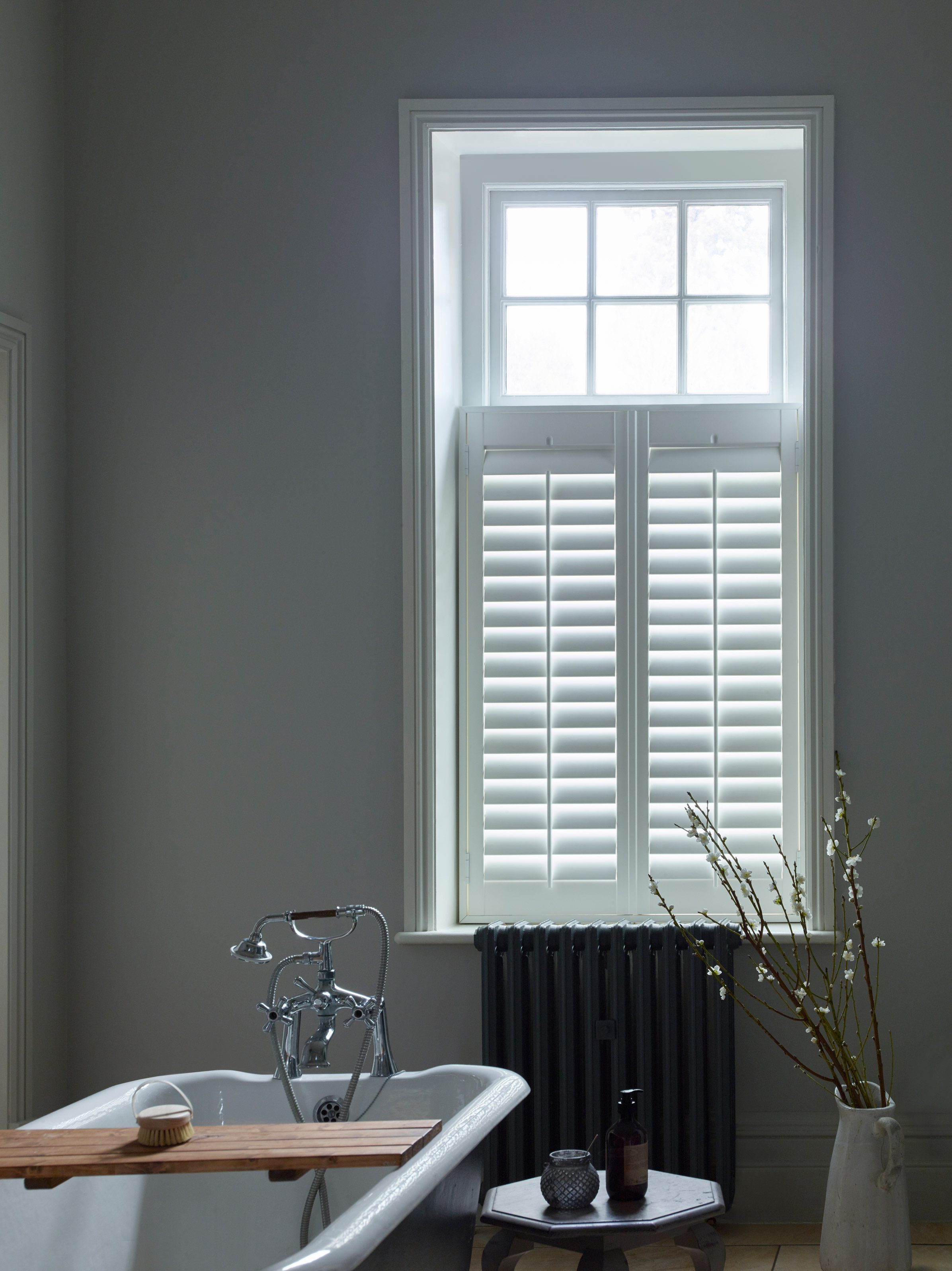 white cafe style shutters in bathroom