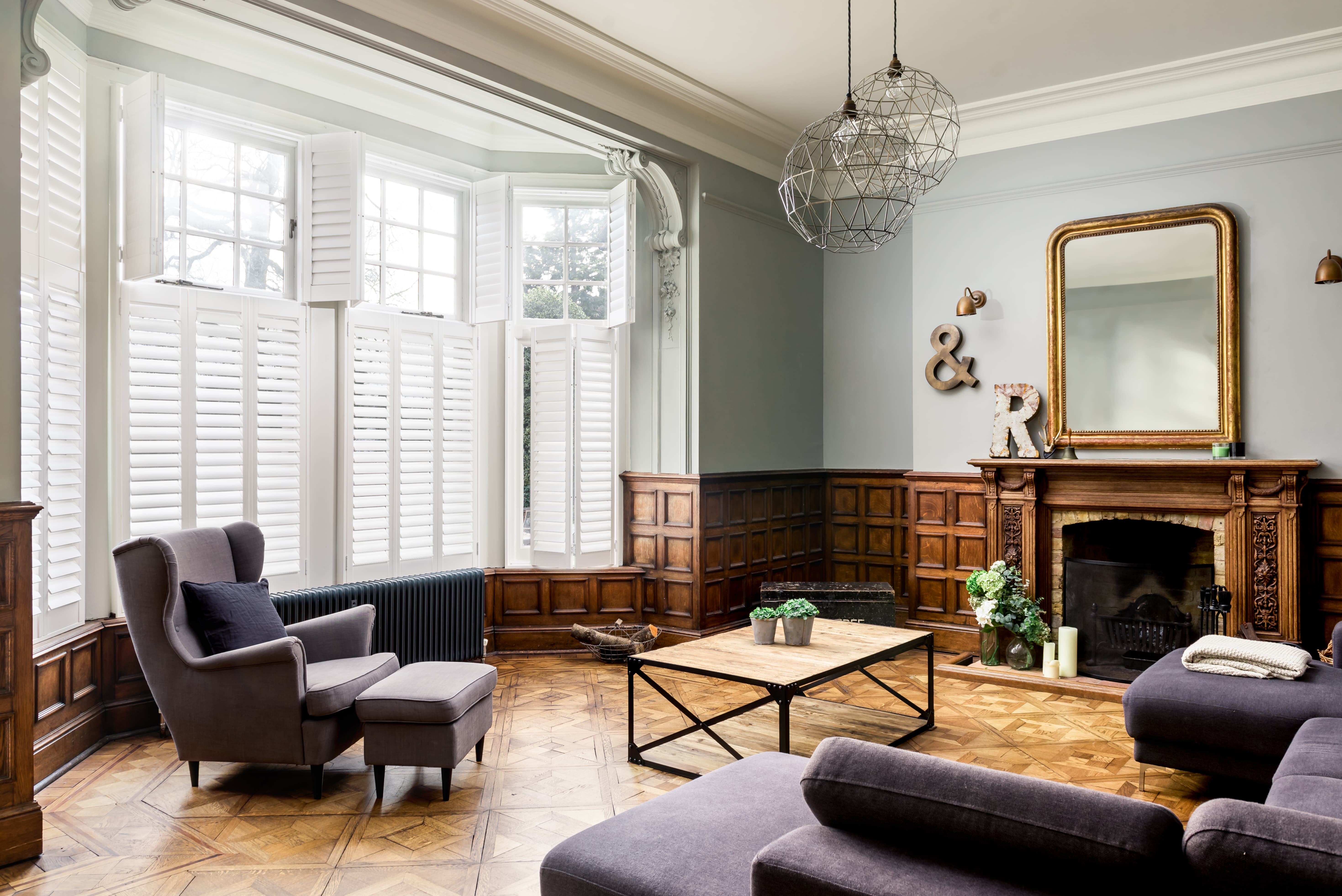 Bright white tier on tier shutters in the living room