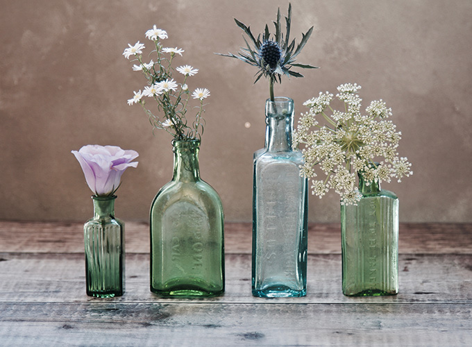 Rustic bottles with flowers