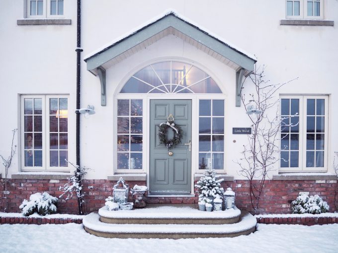 green door with holy wreath on the front