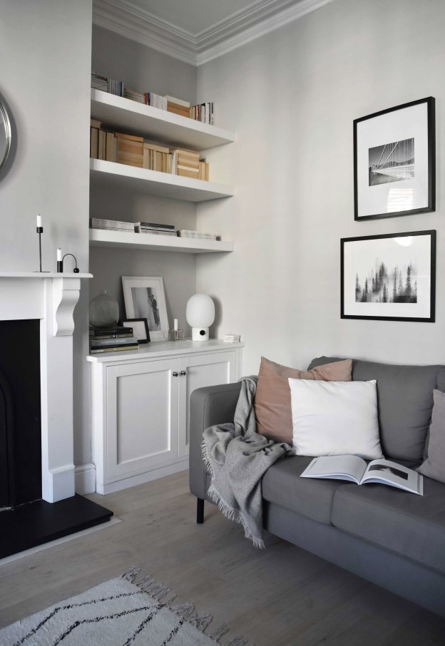 living room with sofa pictures on the wall and ornaments 