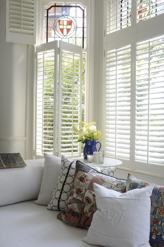 decorated bay window with tier on tier shutters