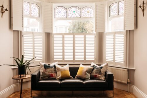 Beautiful bay windows with tier on tier shutters