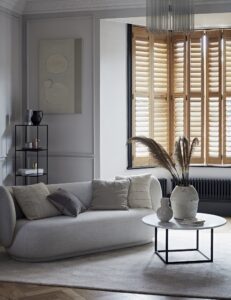 Natural wooden bay window shutters