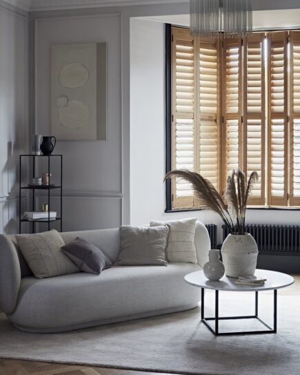Natural wooden bay window shutters