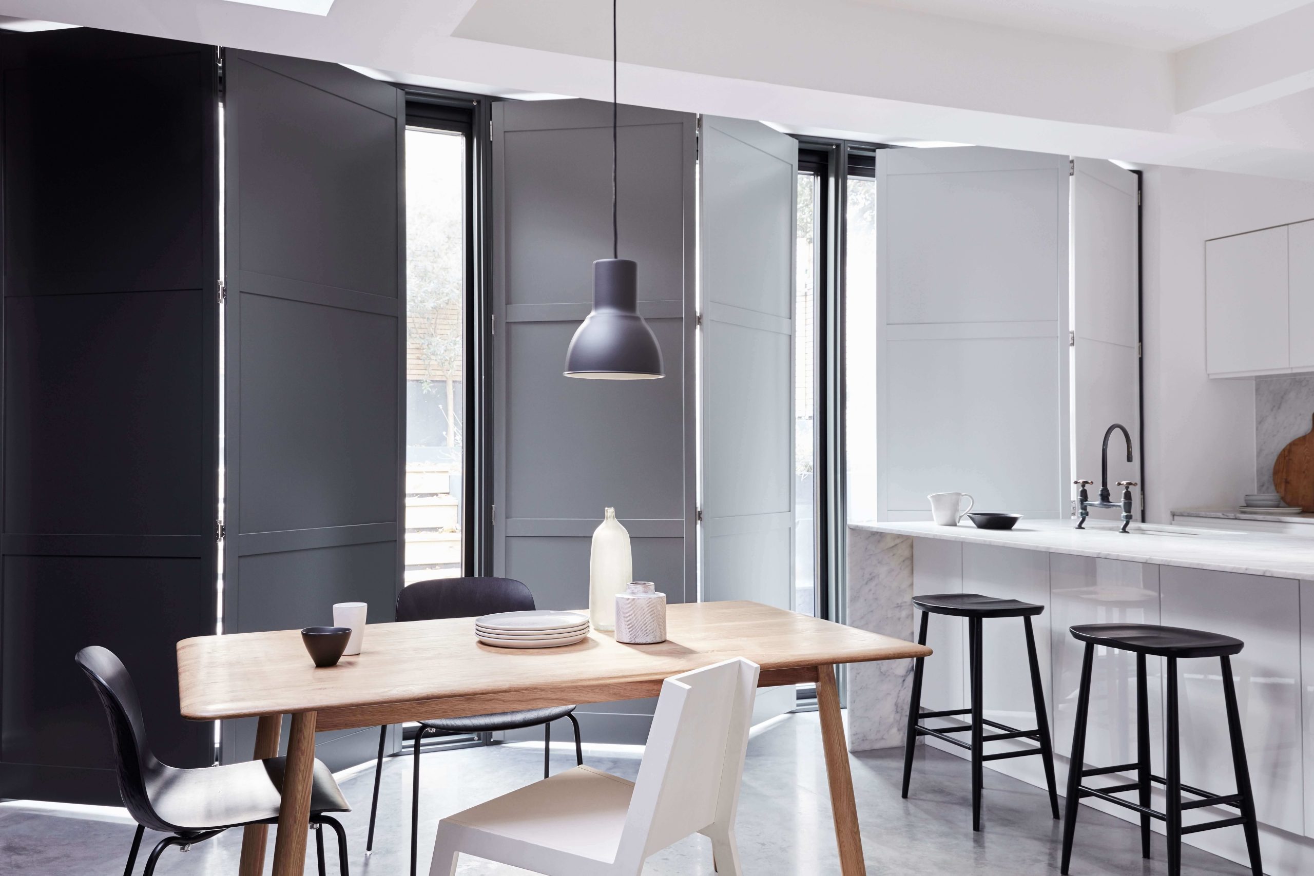 Solid panel shutters on doors in dining room