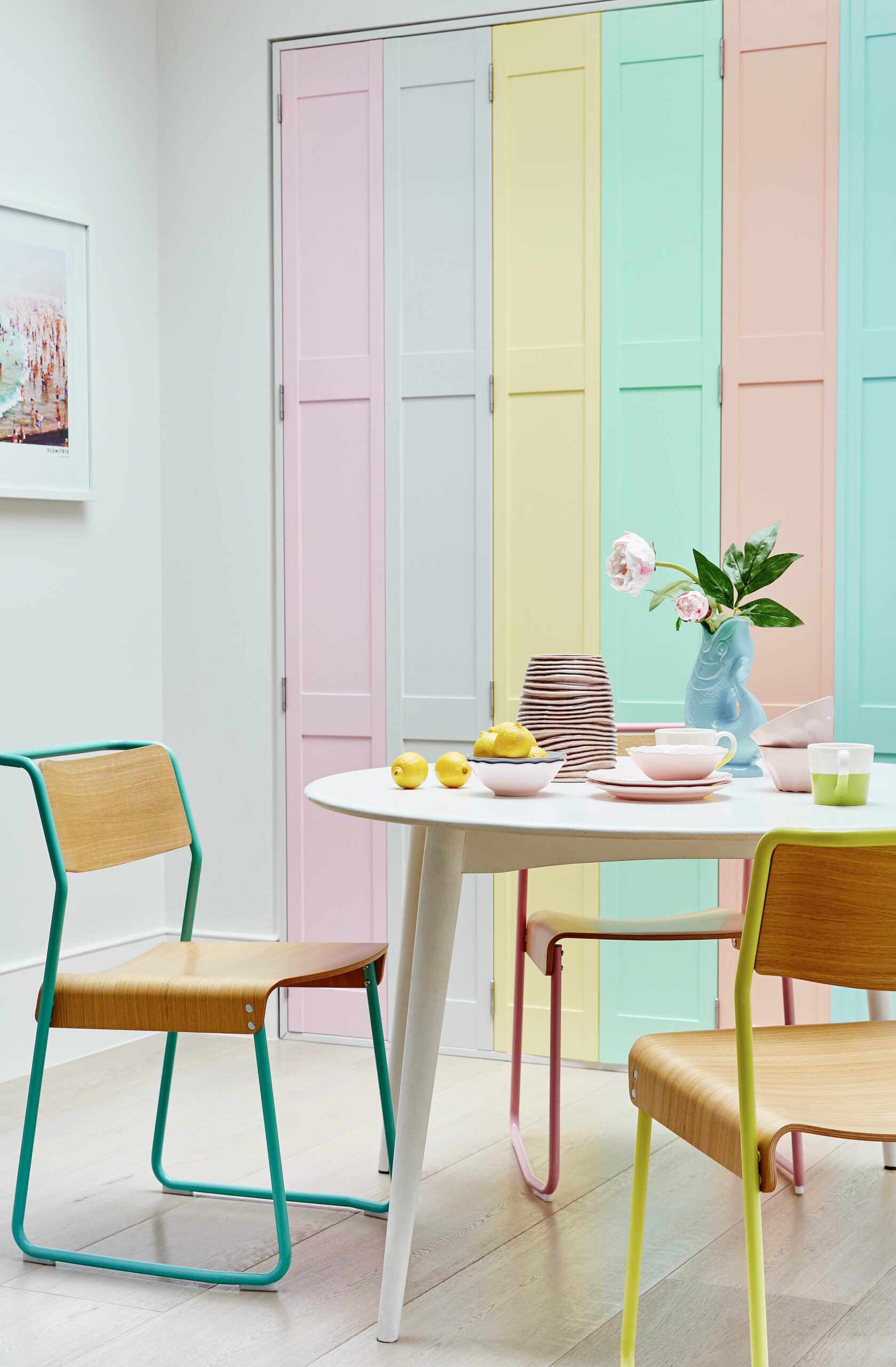 Multi coloured solid panel shutters in dining room