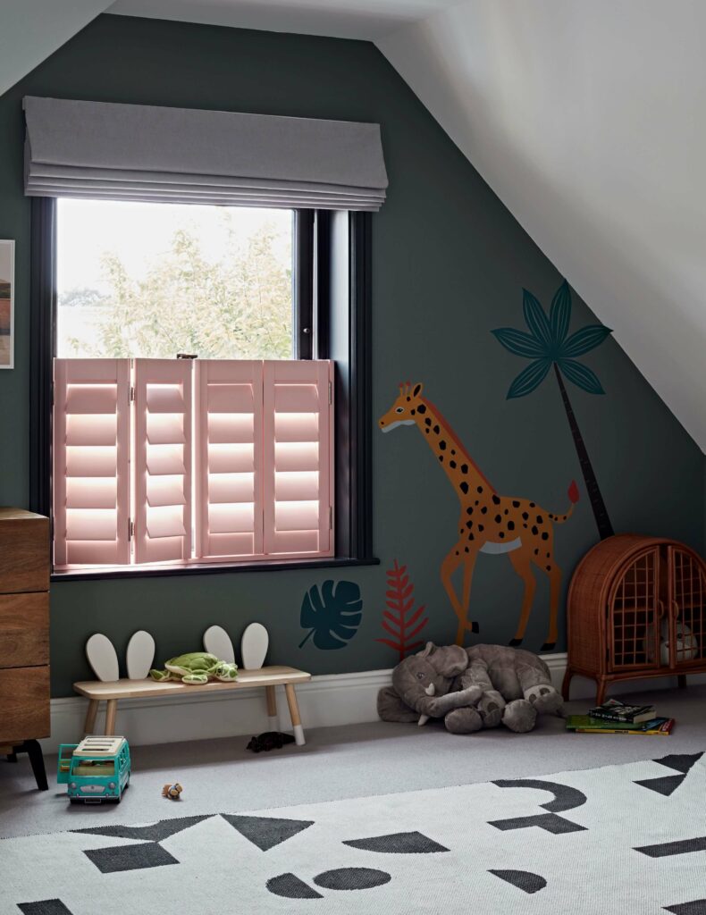 Pink cafe style window shutters in nursery