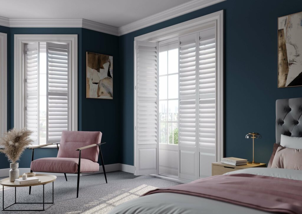 Full height window shutters in bedroom