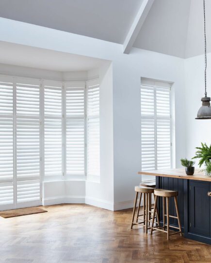 Full height window shutters in kitchen