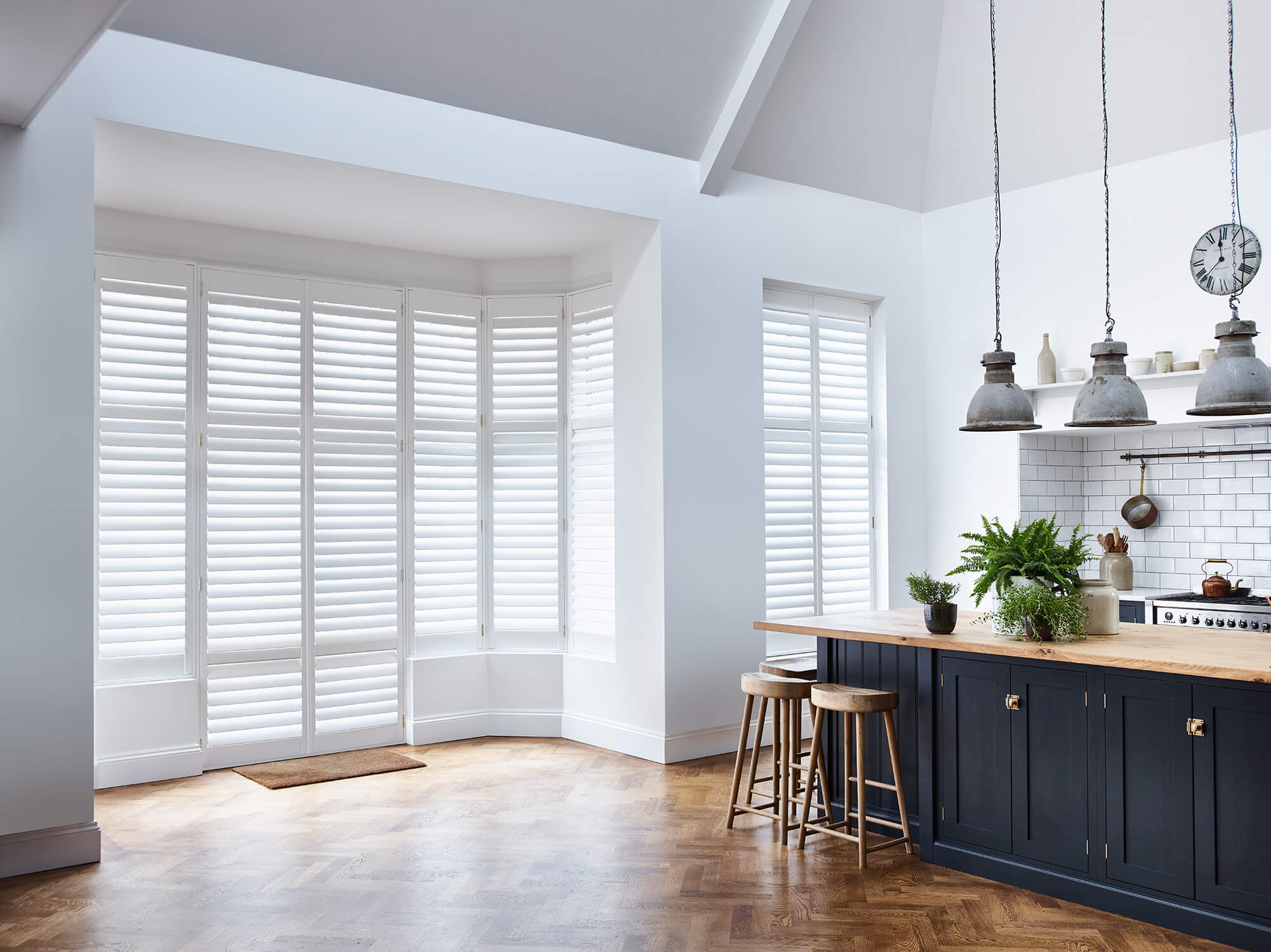 Full height window shutters in kitchen