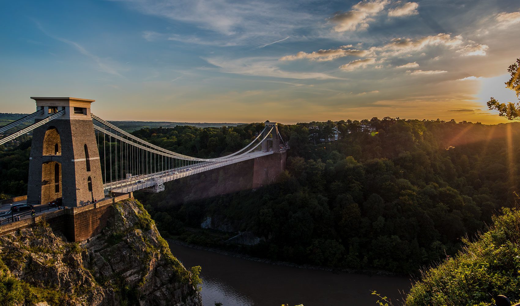 A large bridge over water and trees in the West Country