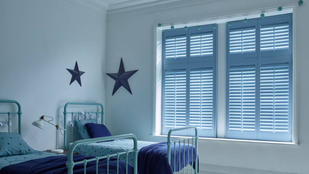 tier on tier bedroom shutters in blue