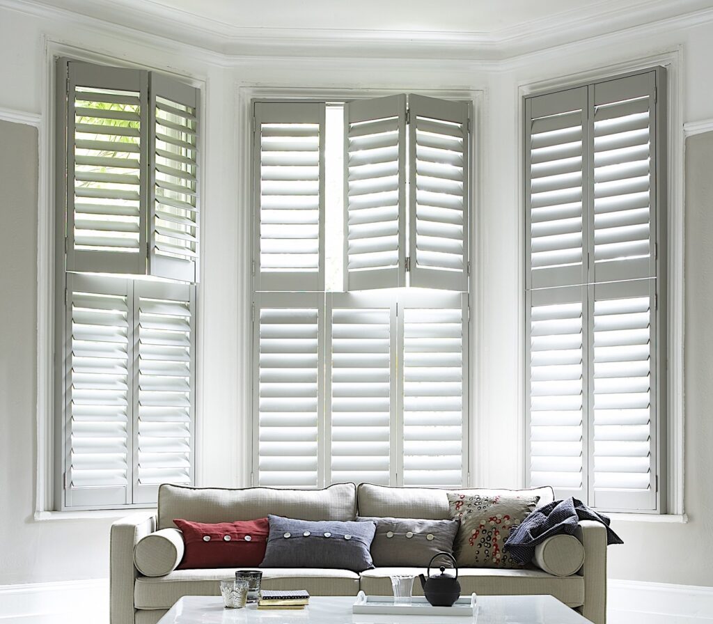 white tier on tier living room window shutters