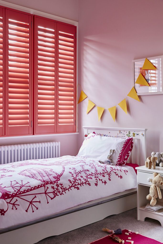 custom coral full height window shutters on bedroom windows