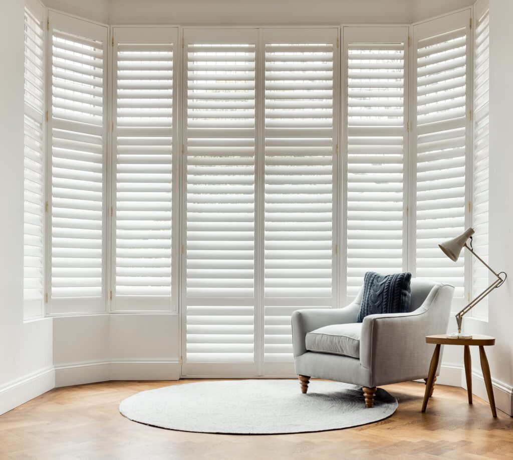 white window shutters on large entrance way