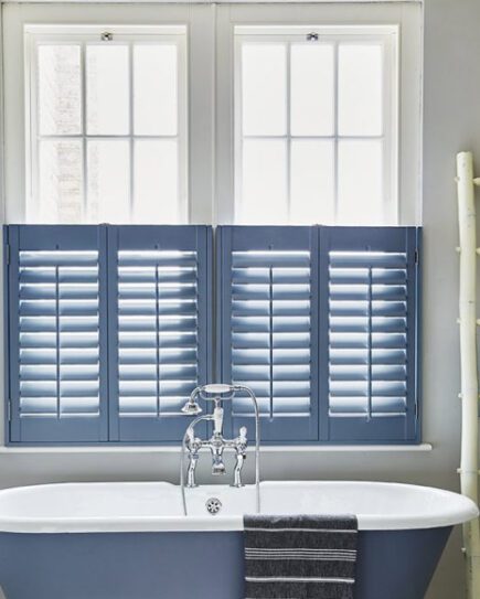 Sash window shutters in a bathroom