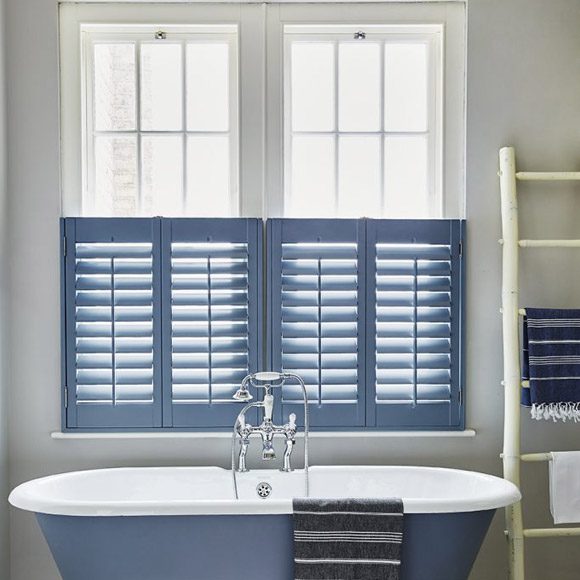 Sash window shutters in a bathroom