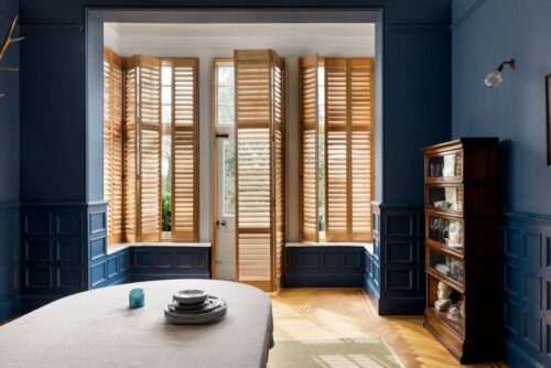 full height natural wooden dining room shutters