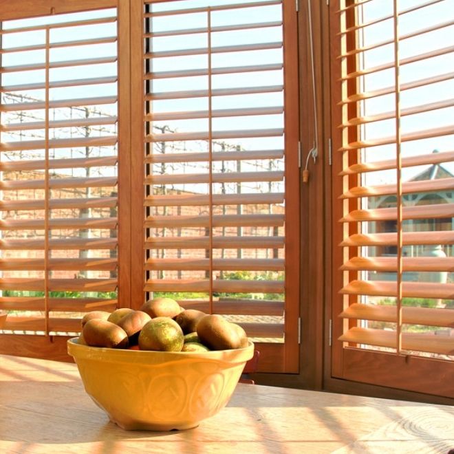 Wooden conservatory shutters close up