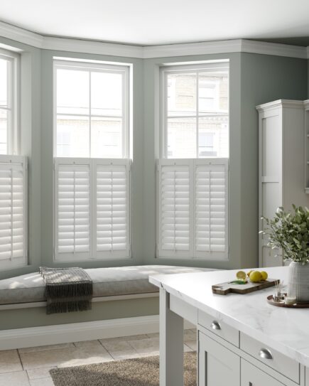 White tier on tier living room shutters