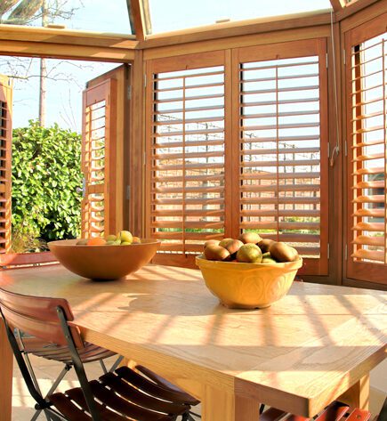 Wooden finish conservatory window shutters